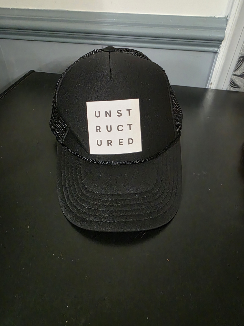 UNSTRUCTURED Black Trucker Cap - Structure Brand